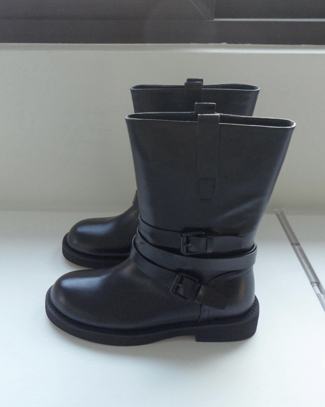 two buckle black boots